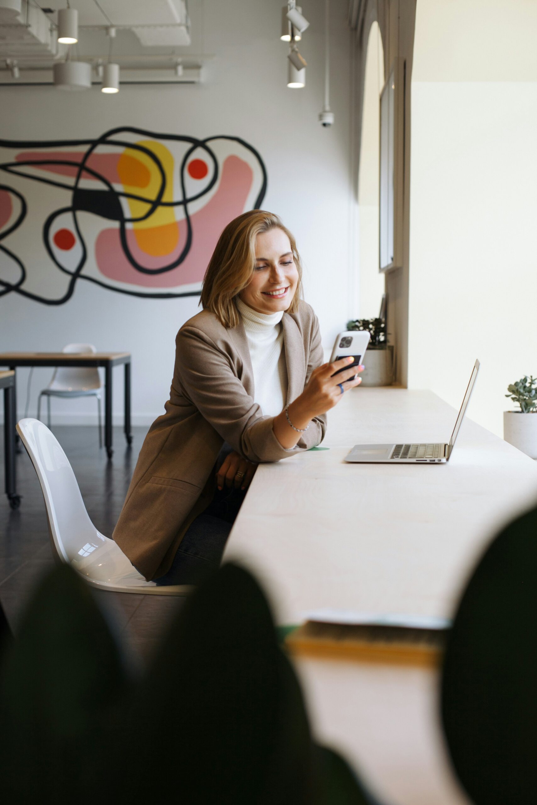 real estate agent looking at phone - Ollin Reach