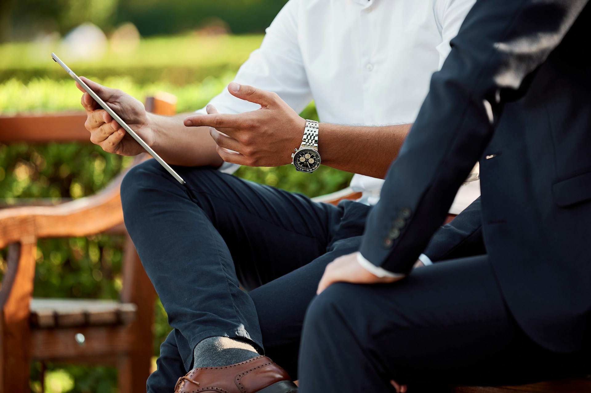 two men in suits discussing real estate leads - Ollin Reach